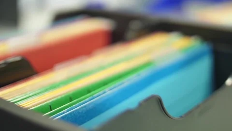 Colored folders with documents slider shot Stock Footage 79065316