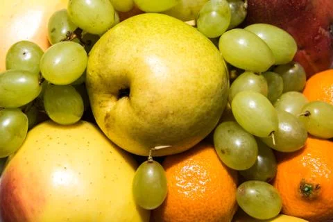 Colored fruits on table Stock Photos