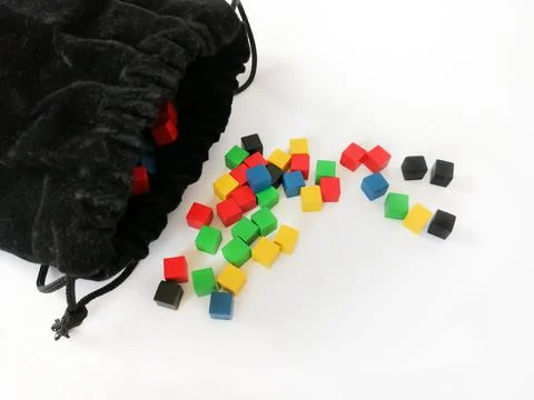 Colored, game cubes next to a black storage bag. Bright cubes for children. G Foto stock