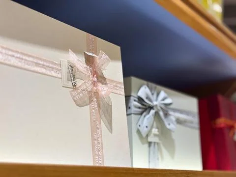 Colored gift boxes wrapped with delicate ribbons Stock Photos