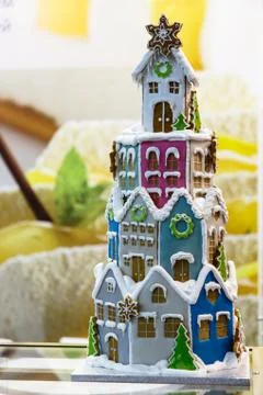 Colored gingerbread house in the form of a high tower Stock Photos