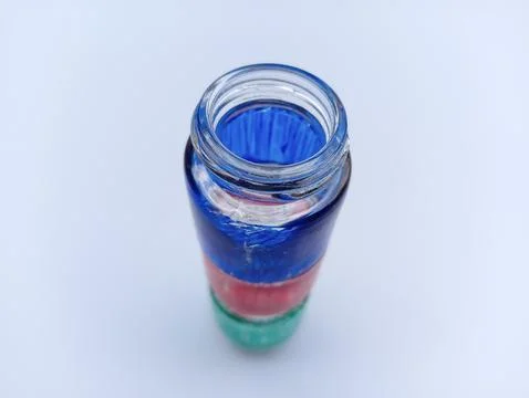 Colored glass bottles on white background  Stock Photos