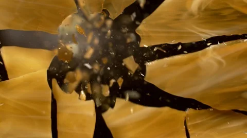 Colored Glass breaking in slow motion on black background Stock Footage 126223552