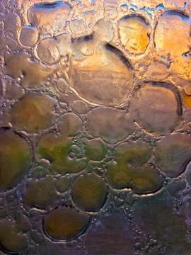 Colored glass with bubbles inside. blown glass. fusing. abstract glass back.. 写真素材