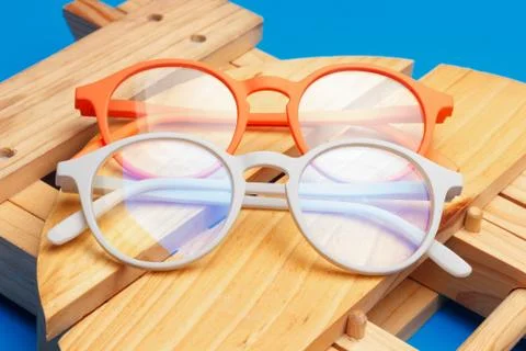 Colored glasses on plain background, modern glasses for fashion. Stock Photos