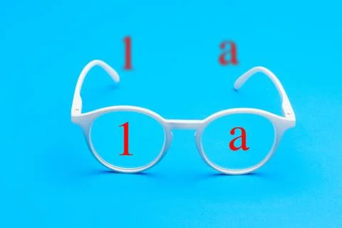 Colored glasses on plain background, modern glasses for fashion. Stock Photos