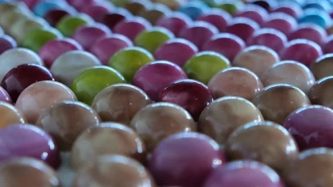 Colored glazed bonbon chocolates. Stock Footage 133412346
