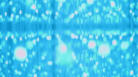 Colored glow of thousands of LEDs in hanging strips with flashes and fading Stock Footage 323901562