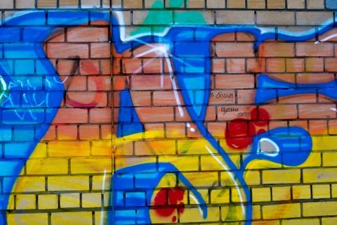 Colored graffiti on a brick wall Fotos de archivo