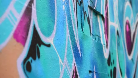 Colored graffiti on a city wall (with slider) Stock Footage 109678875
