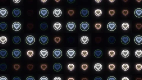 Colored hearts in a pattern on a dark background Stock Footage 338227486