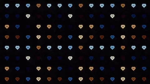 Colored hearts in a pattern on a dark background Stock Footage 338276600