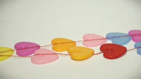 Colored hearts on a rope Stock Footage 99476715