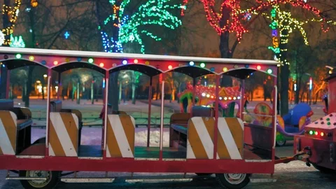 Colored Holiday Lights on the Children's Train at Night Park Stock Footage 101553427