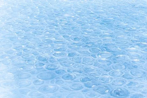 Colored ice. Abstract ice texture. Nature background. Sea ice. patterns on ic Stock Photos