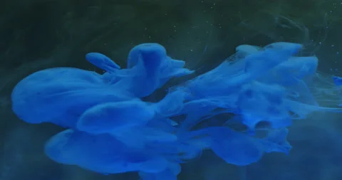 Colored ink / colored smoke diffuses in the water Stock Footage 195290637