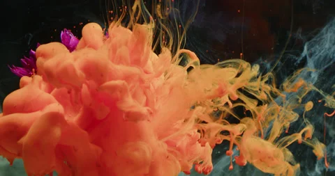 Colored Ink / Colored Smoke Sprayed Flowers In The Water Stock Footage 195292911