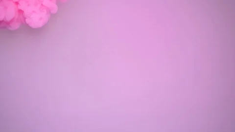 Colored ink spreading in water, abstract footage for motion design. Stock Footage 102825779