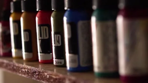 Colored ink for tattoos in a shelf Stock Footage 194455253