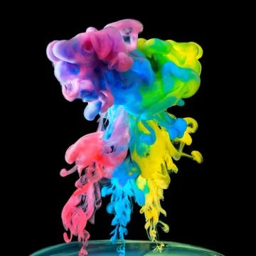Colored inks in water on black background Stock Photos