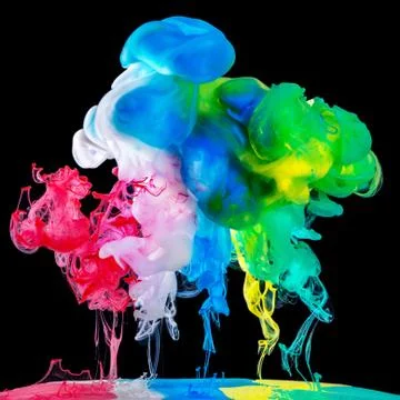 Colored inks in water on black background Stock Photos