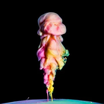 Colored inks in water on black background Stock Photos