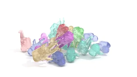 Colored jelly sweets in the form of astronauts falling on a white bg Stock Footage 281021115