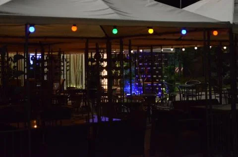 Colored lanterns in the night cafe Stock Photos