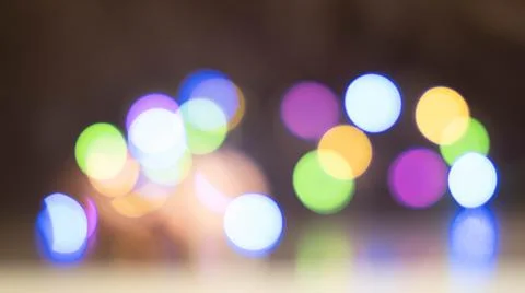 Colored large bokeh on a black background Stock Photos