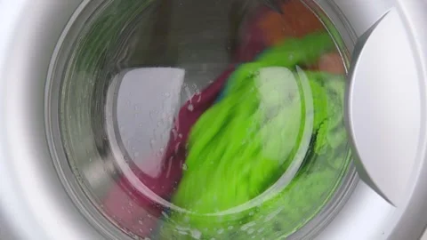 Colored laundry is washed in the washing machine Stock-Footage 310316646