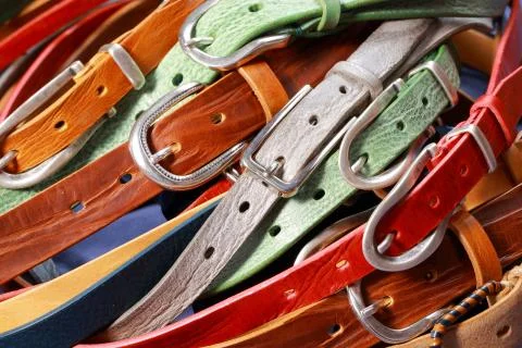 Colored leather straps on a white background Stock Photos