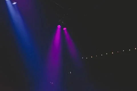 Colored light beams in nightclub. Stock Photos