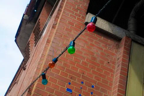 Colored light bulbs on the chain Stock Photos