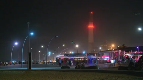 Colored Lights diffuse on Tel-Aviv's Boardwalk at Night Stock Footage 89148906