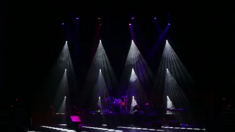 Colored lights on an empty concert stage with smoke. Stage lights and smoke. Video stock 105354154