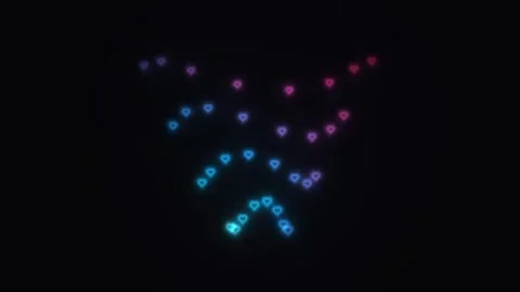 Colored lights form heart shapes in dark background Stock Footage 338277150
