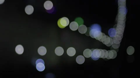 Colored lights generated by cars passing on the road at night bokeh Stock Footage 61785627