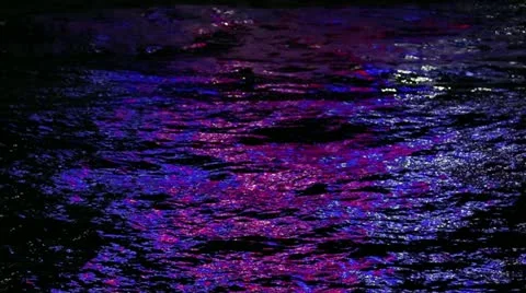 Colored Lights Reflecting On Ocean At Night HD Stock Footage 18646582