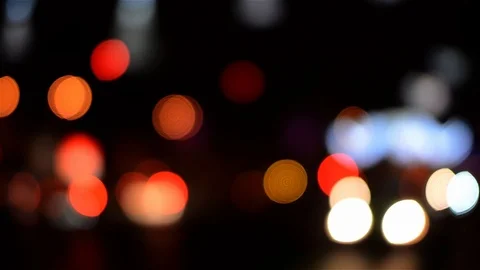 Colored lights who walks through the streets of a city night dark Vídeos de archivo 95737356