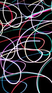 Colored lines on a black background.textura Stock Illustration
