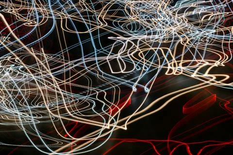 Colored lines of lights on a black background Stock Photos