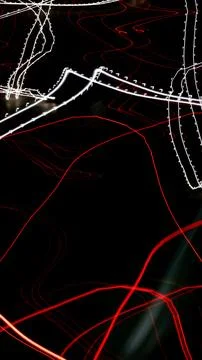 Colored lines of lights on a black background Stock Photos