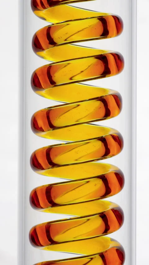 Colored Liquid Flowing Through Spiral Tube. Video stock 339870671