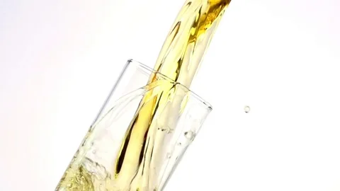 Colored liquid pouring in to the glass Stock Footage 75814058