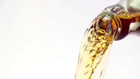 Colored liquid pouring in to the glass Stock Footage 76433076
