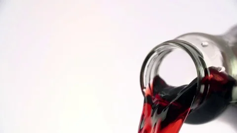 Colored liquid pouring in to the glass Stock Footage 76433088