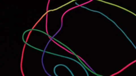 Colored long rope on black background Stock Footage 150275046