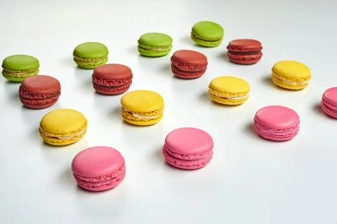 Colored macaron or macaroon, sweet meringue-based confection isolated on white Fotos Stock