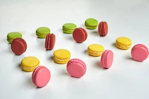 Colored macaron or macaroon, sweet meringue-based confection isolated on white Fotos Stock