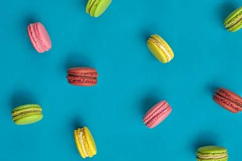 Colored macaron or macaroon, sweet meringue-based confection on blue backg... Fotos Stock
